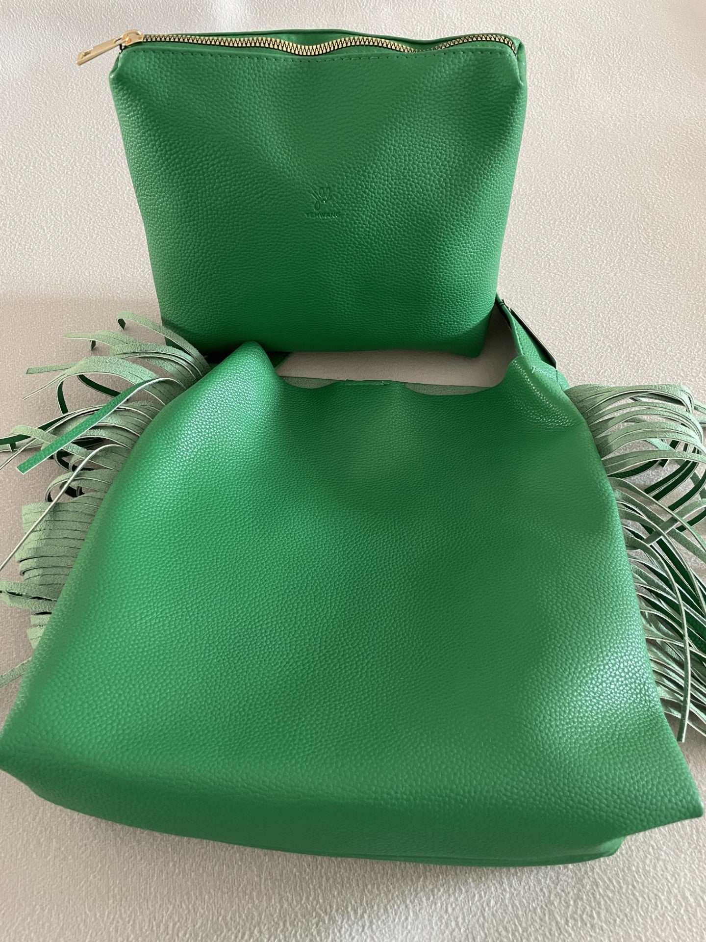 Fringed bag and pocket