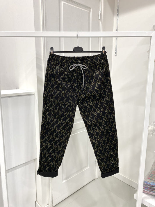 Pantalon taille élastique noir et doré