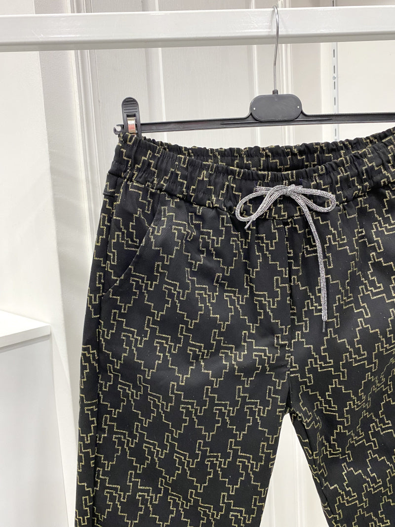 Pantalon taille élastique noir et doré